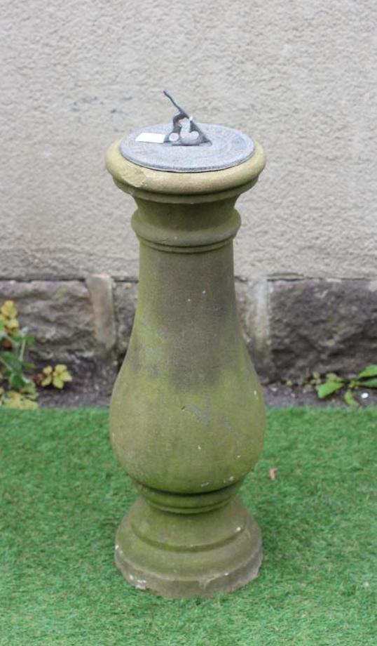 A VICTORIAN SANDSTONE SUNDIAL of baluster form with moulded circular base, the later lead dial with Image