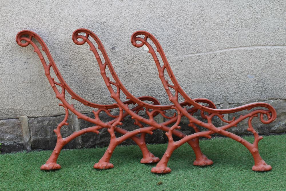 A SET OF THREE VICTORIAN CAST IRON PARK BENCH SUPPORTS in truncated branch pattern, 28 1/2"x 29" Image