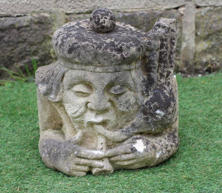 A VICTORIAN CARVED SANDSTONE BUST OF A SCOTSMAN with tam o' shanter and bagpipes, 12" x 13 1/2" Image