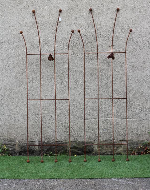A PAIR OF HAND FORGED WROUGHT IRON WALL PLANT SUPPORTS of splayed outline with ball finials, 23 - 29 Image