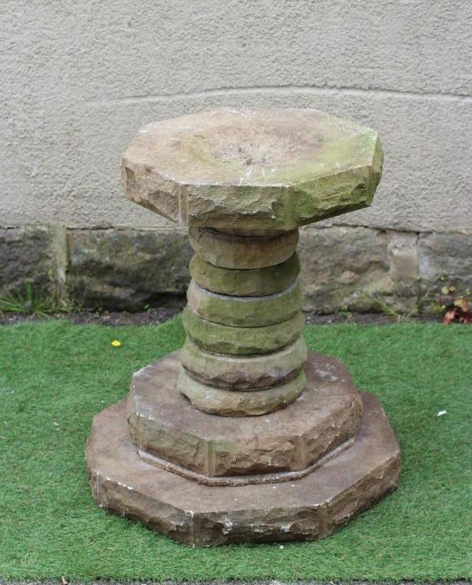 A SANDSTONE BIRDBATH, the octagonal bowl on sectional disc stem and stepped base, 24" x 26 1/4" Image