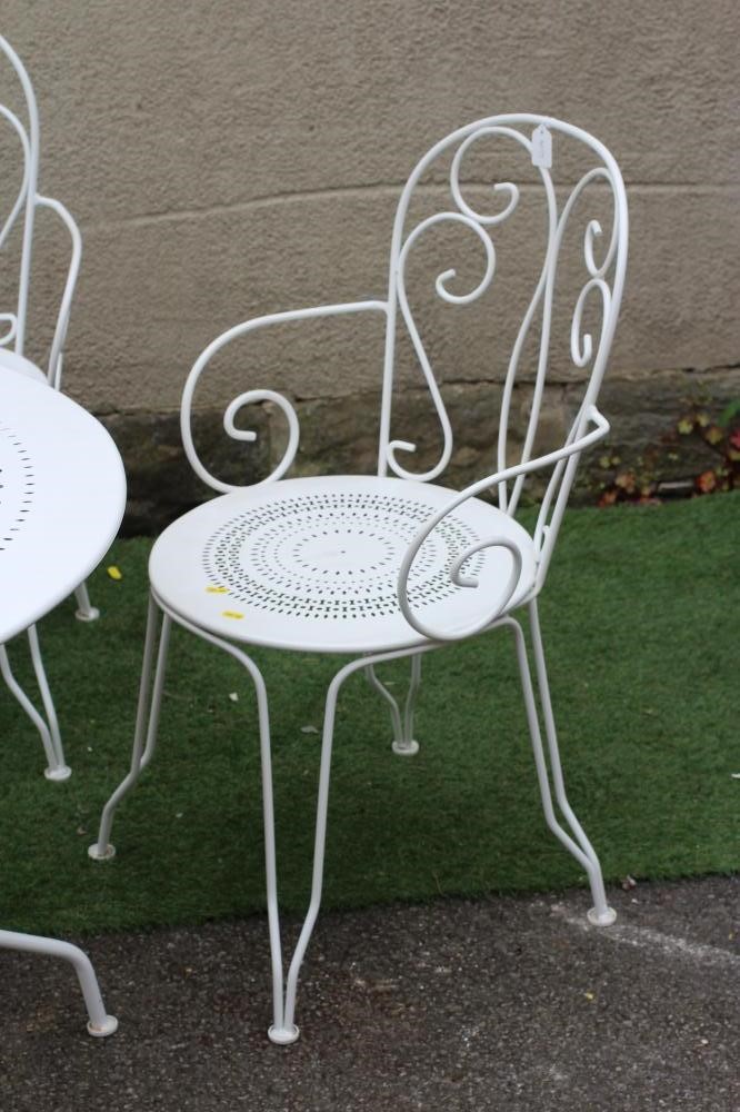 A WHITE PAINTED FRENCH BISTRO WIRE WORK SUITE, comprising circular table with pierced top on down Image