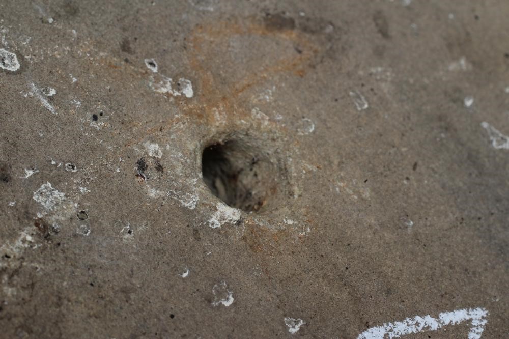 A PAIR OF CARVED SANDSTONE GREEN MAN WALL MASKS of shallow oblong form, stained brown, 13 1/2" x 5 Image
