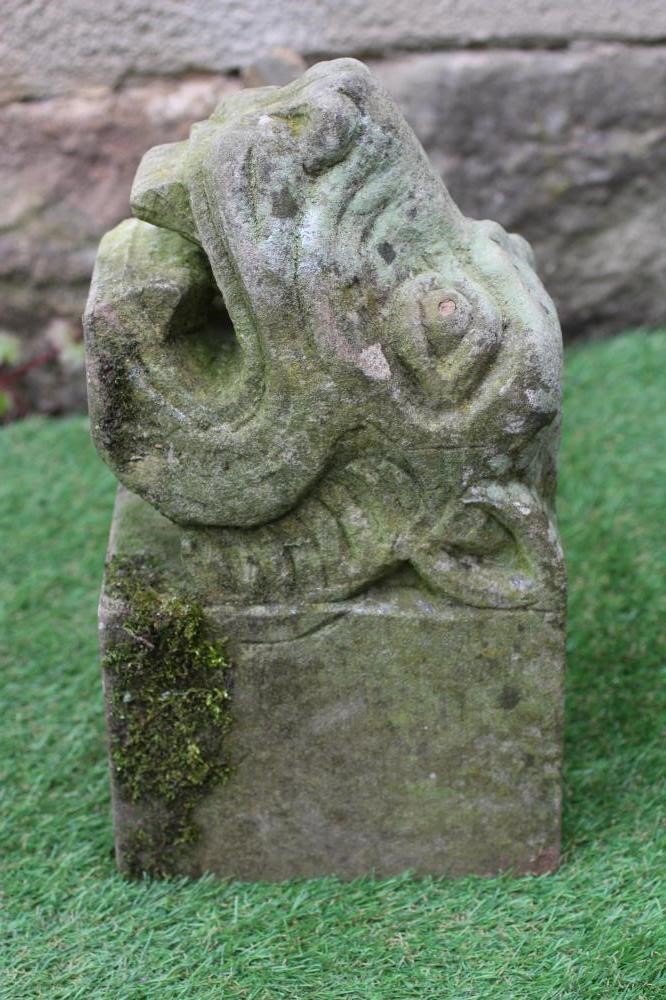 A CARVED SANDSTONE GARGOYLE modelled as a mythical beast, 15" x 6" (Est. plus 24% premium inc. VAT) Image