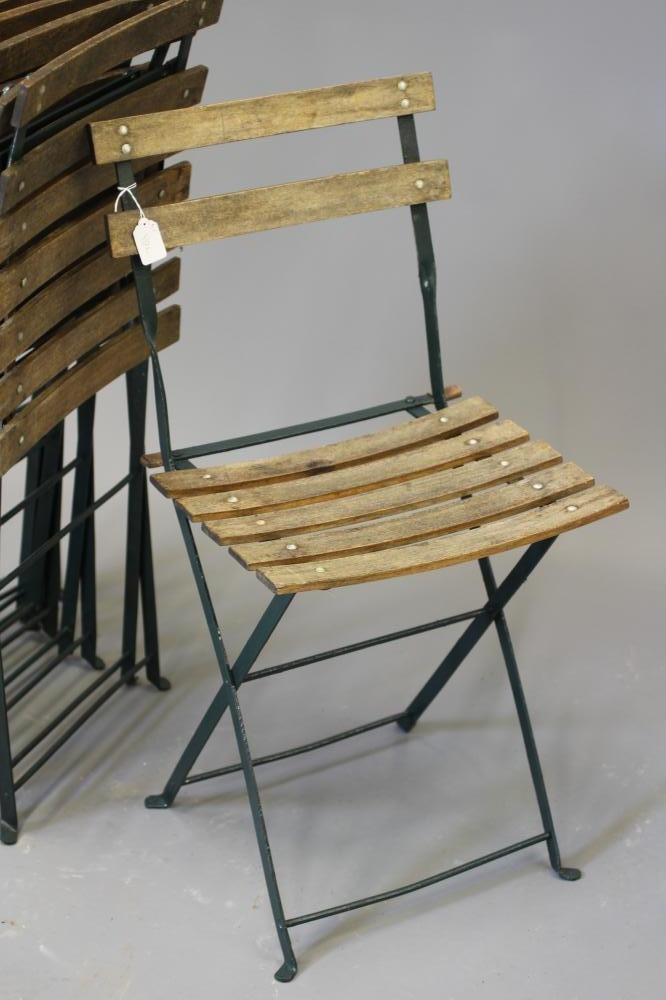 A SET OF SIX FRENCH BISTRO FOLDING CHAIRS of usual form, the painted metal frame with slatted wood Image