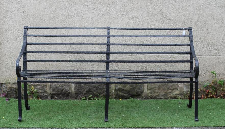 A VICTORIAN WROUGHT IRON STRAPWORK GARDEN BENCH with scrolled arms and feet, 72" x 15 1/2" x 35 1/4" Image