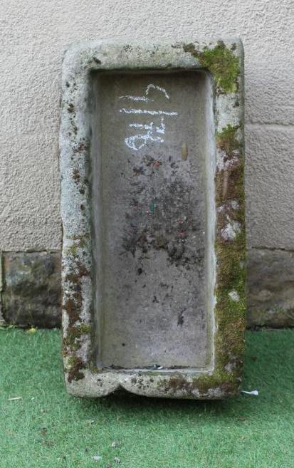 A SANDSTONE TROUGH of rough hewn oblong form, 30 1/2" x 15 1/2" x 10" (Est. plus 24% premium inc. Image