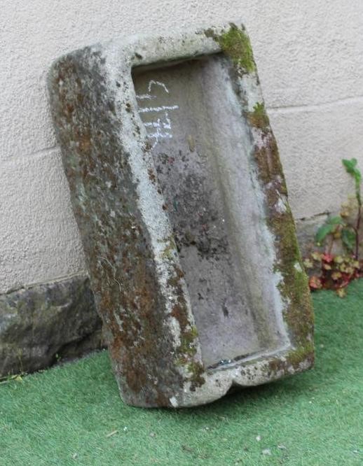 A SANDSTONE TROUGH of rough hewn oblong form, 30 1/2" x 15 1/2" x 10" (Est. plus 24% premium inc. Image