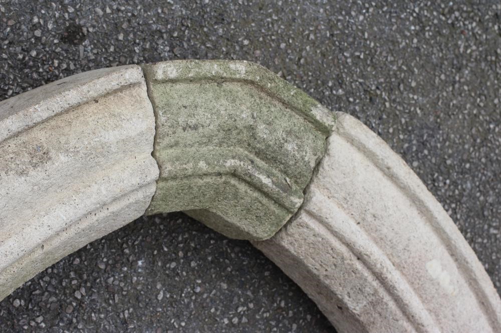 A CAST STONE GOTHIC ARCH, the octagonal supports on ogee moulded base and square plinth, 80" x 87" Image