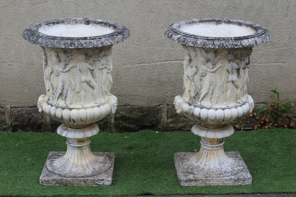 A PAIR OF LARGE CAST STONE MEDICI STYLE URNS, with frieze of classical figures over a fluted base, Image