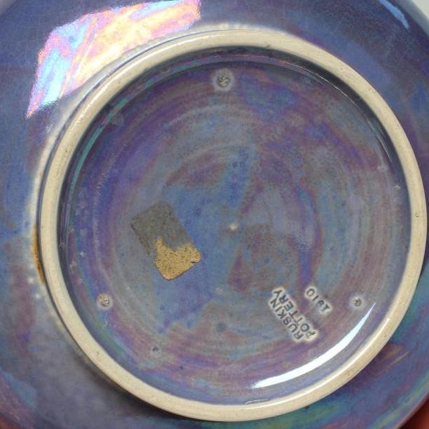 A RUSKIN POTTERY LILAC LUSTRE GLAZED BOTTLE VASE, 1910, impressed mark and date, 11" high (Est. plus Image