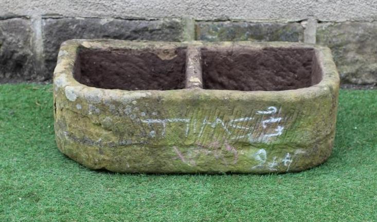 A SANDSTONE TROUGH of well cut D form with central division, 30" x 17 1/4" x 9 1/2" Image