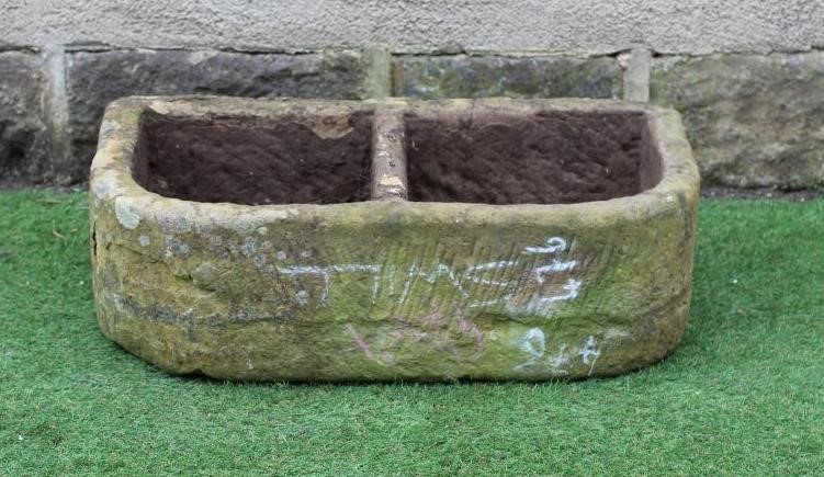 A SANDSTONE TROUGH of well cut D form with central division, 30" x 17 1/4" x 9 1/2" Image