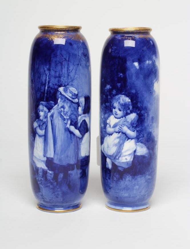 A PAIR OF ROYAL DOULTON 'BLUE CHILDREN' VASES, early 20th century, of rounded cylindrical form, Image