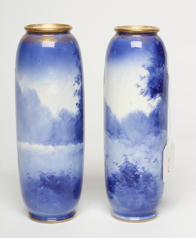 A PAIR OF ROYAL DOULTON 'BLUE CHILDREN' VASES, early 20th century, of rounded cylindrical form, Image