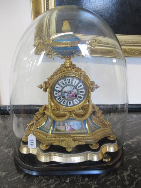 A FRENCH GILT METAL AND PORCELAIN MANTEL CLOCK Image