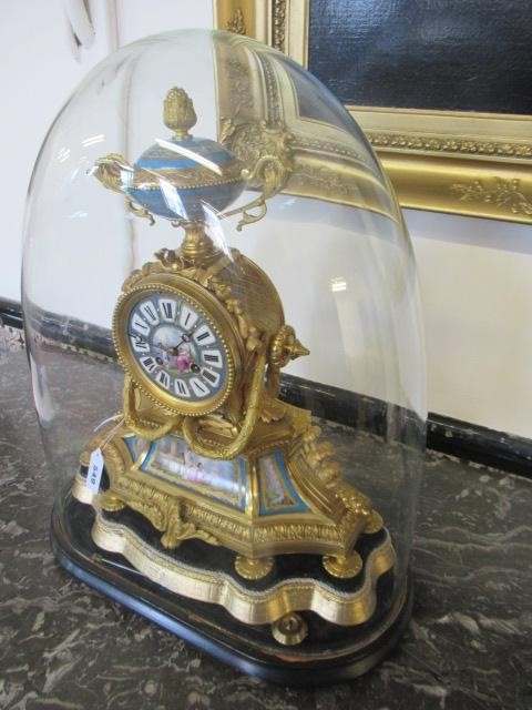 A FRENCH GILT METAL AND PORCELAIN MANTEL CLOCK Image
