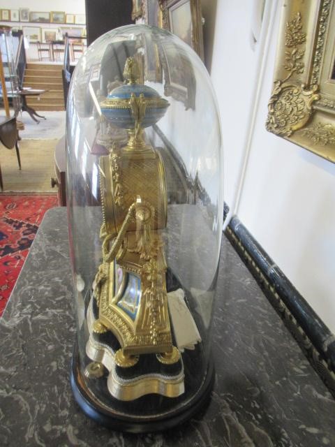 A FRENCH GILT METAL AND PORCELAIN MANTEL CLOCK Image