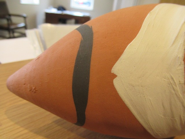 PABLO PICASSO (1881-1973) A red earthenware fish pitcher with black and white markings Image