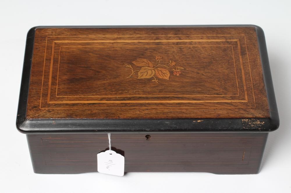 A SMALL SWISS MUSICAL BOX Image