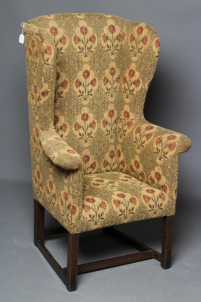 A GEORGIAN OAK FRAMED WING ARMCHAIR Image