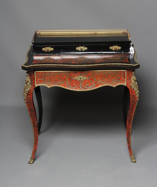 A NAPOLEON III RED BOULLE AND EBONISED BONHEUR DU JOUR Image