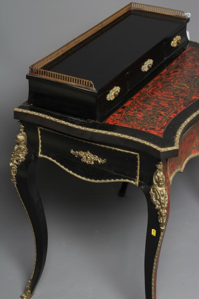 A NAPOLEON III RED BOULLE AND EBONISED BONHEUR DU JOUR Image