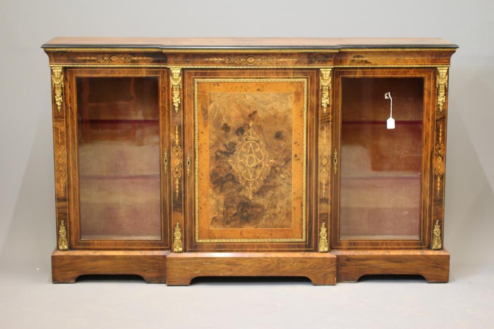 A VICTORIAN BURR WALNUT AND EBONISED CREDENZA of breakfront form with marquetry scrollwork Image