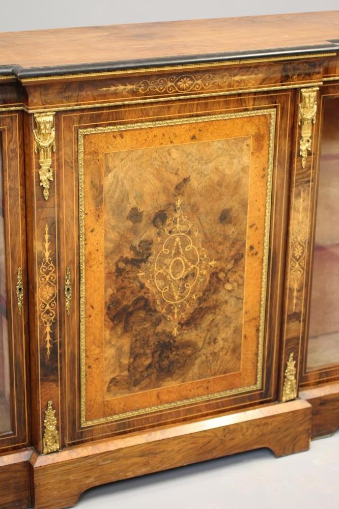 A VICTORIAN BURR WALNUT AND EBONISED CREDENZA of breakfront form with marquetry scrollwork Image