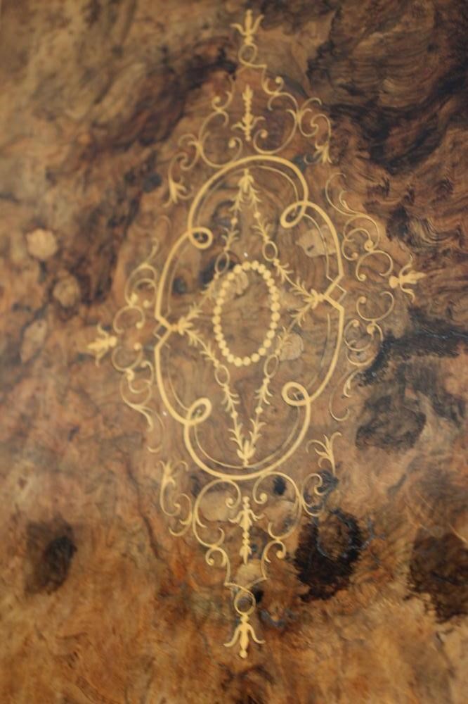 A VICTORIAN BURR WALNUT AND EBONISED CREDENZA of breakfront form with marquetry scrollwork Image
