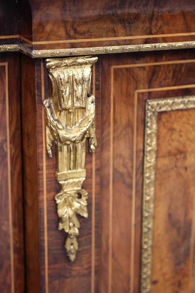 A VICTORIAN BURR WALNUT AND EBONISED CREDENZA of breakfront form with marquetry scrollwork Image