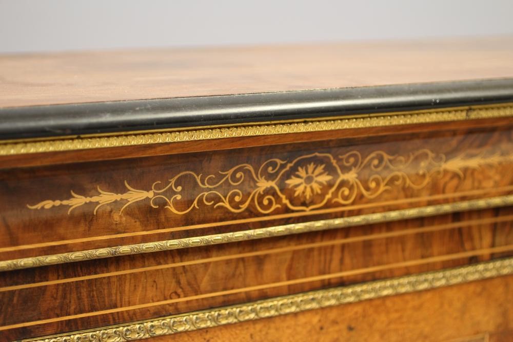 A VICTORIAN BURR WALNUT AND EBONISED CREDENZA of breakfront form with marquetry scrollwork Image