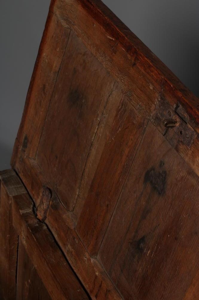 A SMALL OAK PANELLED COFFER, the hinged lid opening to interior with till box, the fascia with a Image