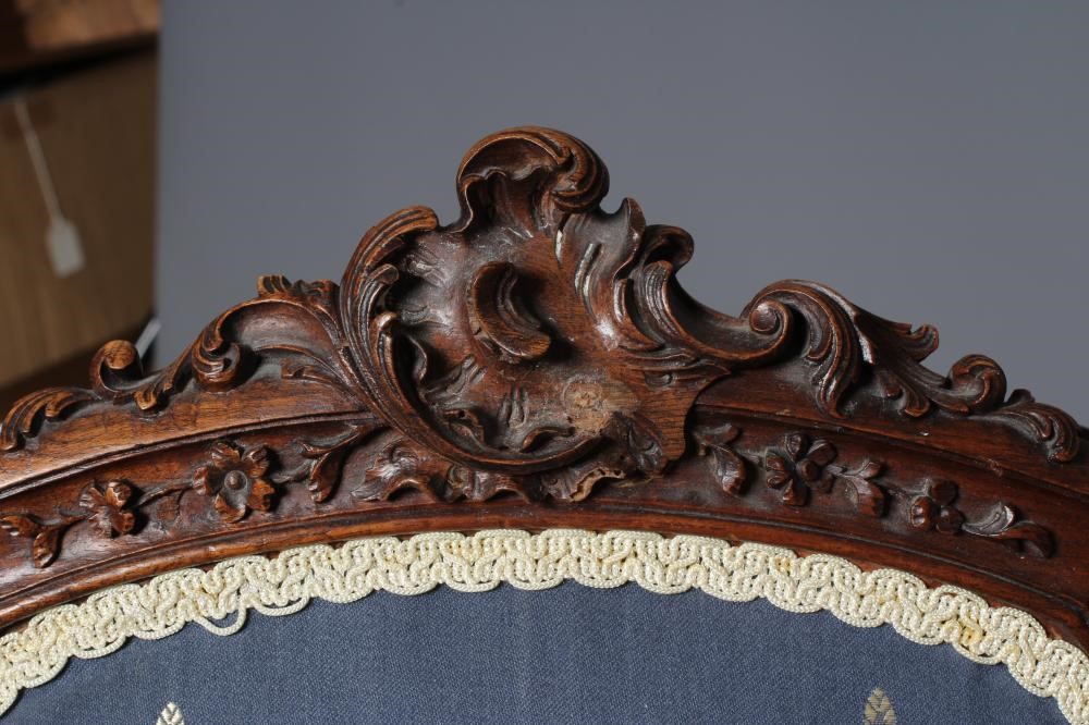 A FRENCH WALNUT SHOW FRAME WING ARMCHAIR Image