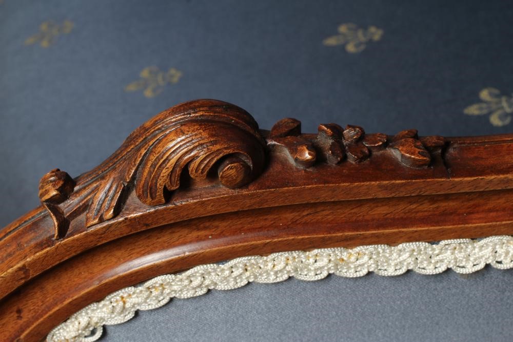 A FRENCH WALNUT SHOW FRAME WING ARMCHAIR Image