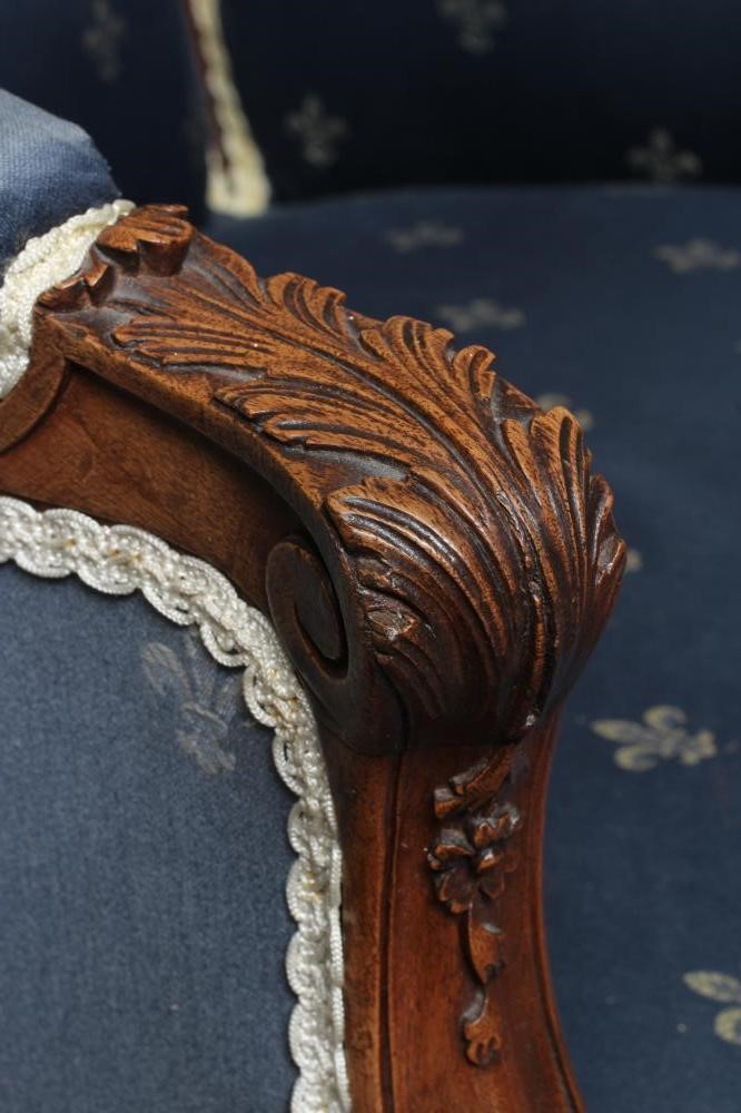 A FRENCH WALNUT SHOW FRAME WING ARMCHAIR Image