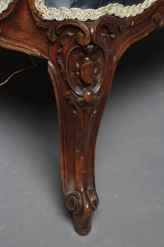 A FRENCH WALNUT SHOW FRAME WING ARMCHAIR Image