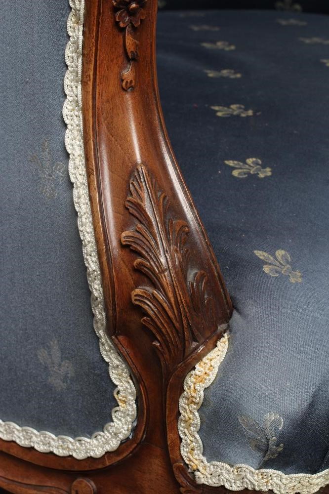 A FRENCH WALNUT SHOW FRAME WING ARMCHAIR Image