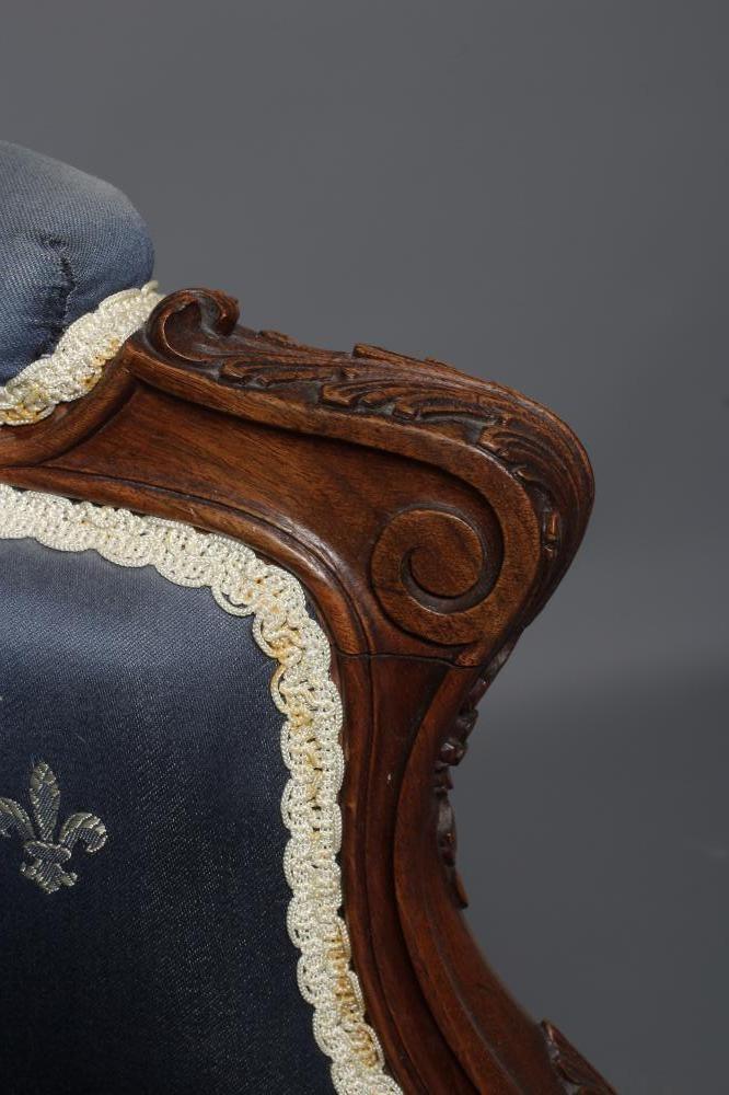 A FRENCH WALNUT SHOW FRAME WING ARMCHAIR Image