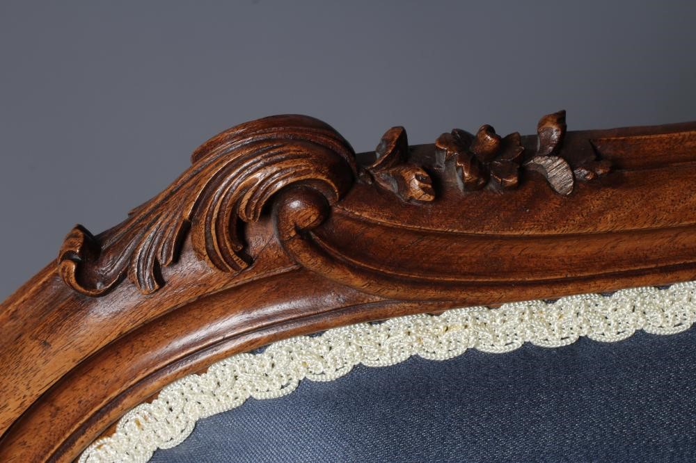 A FRENCH WALNUT SHOW FRAME WING ARMCHAIR Image