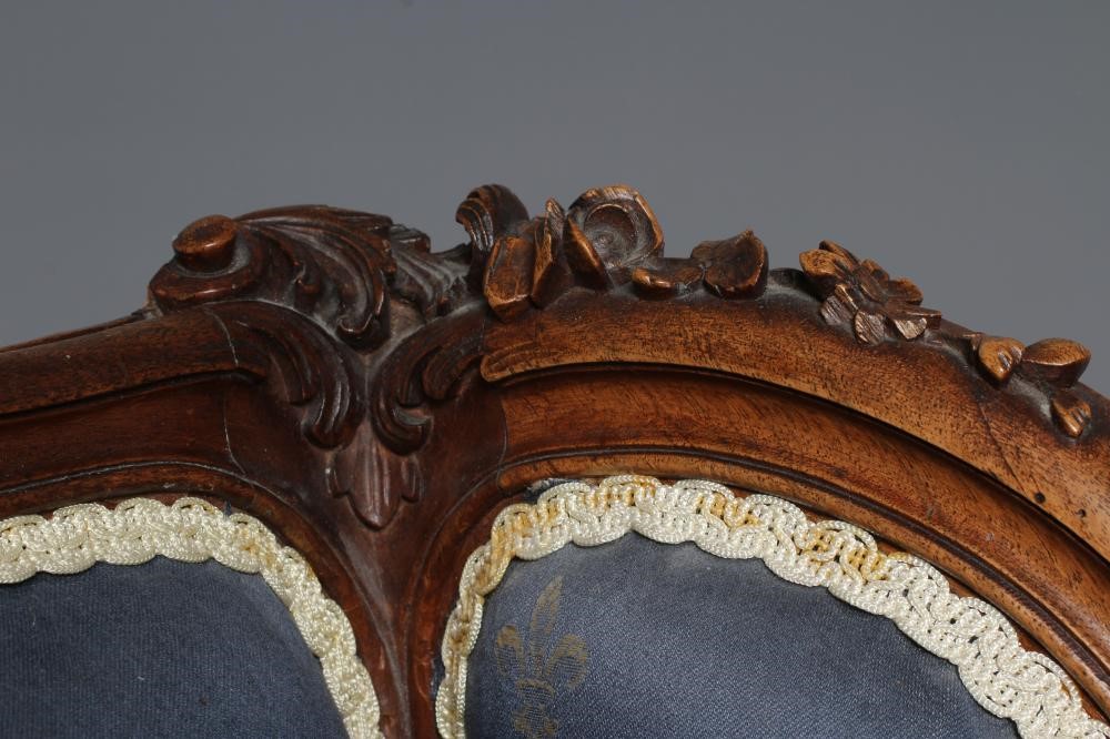 A FRENCH WALNUT SHOW FRAME WING ARMCHAIR Image