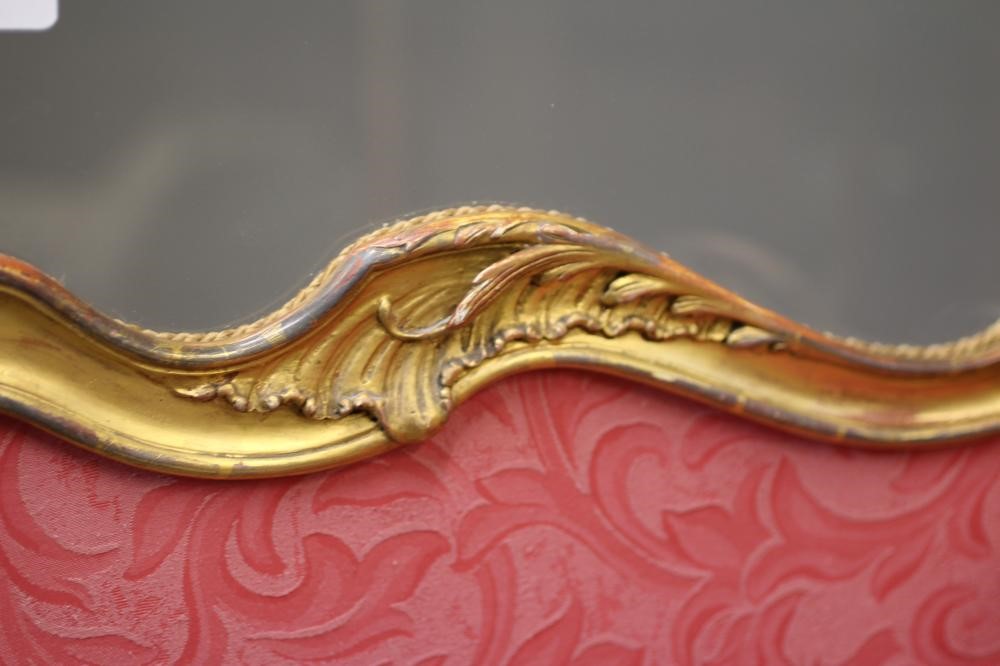 A VICTORIAN GILTWOOD FOLDING ROOM SCREEN in the rococo style carved with rocaille and foliate Image