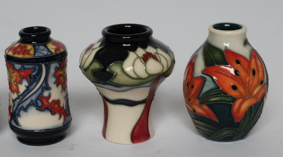 A COLLECTION OF FIVE MINIATURE MOORCROFT POTTERY VASES, including Tiger Daylily, Grapes, 2007, Image