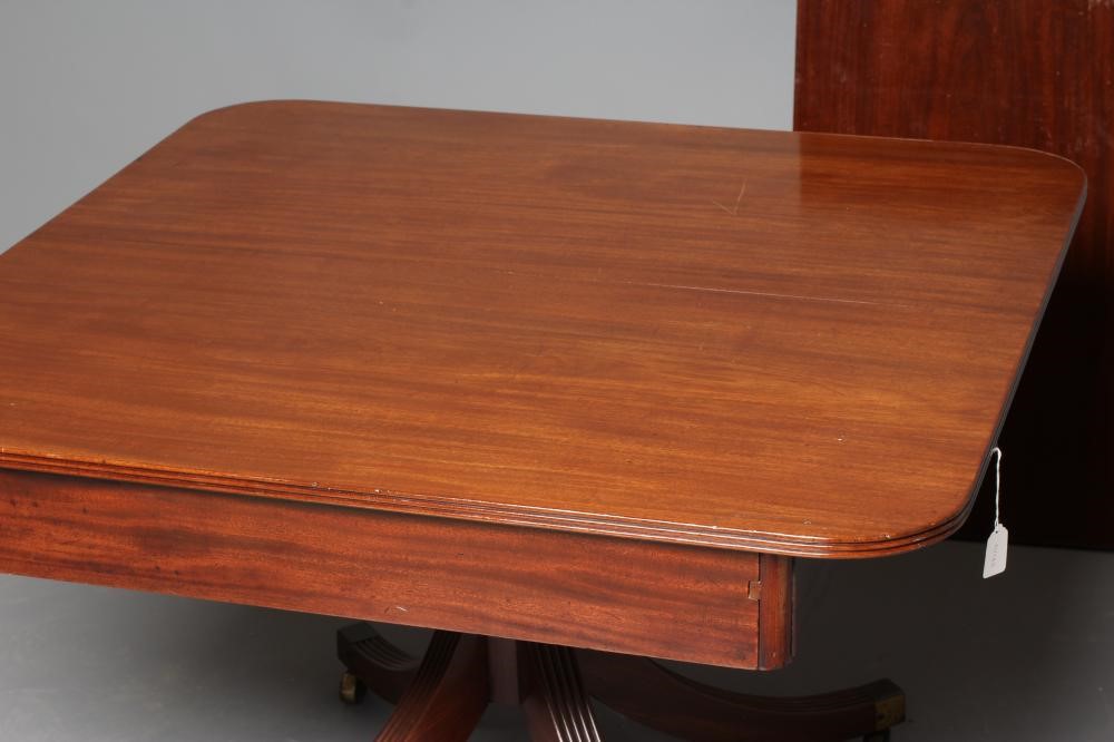 A REGENCY MAHOGANY EXTENDING DINING TABLE Image