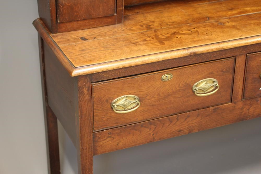 A GEORGIAN OAK AND ELM DRESSER Image