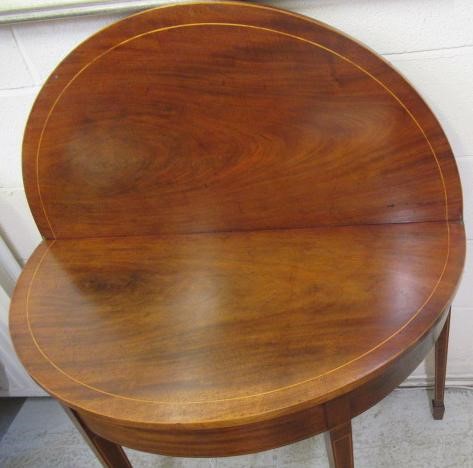 A GEORGIAN MAHOGANY FOLDING TEA TABLE Image