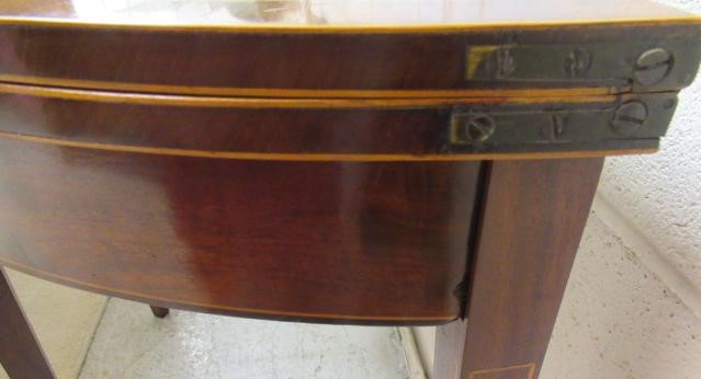 A GEORGIAN MAHOGANY FOLDING TEA TABLE Image