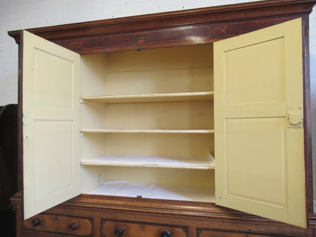 A LARGE GEORGIAN OAK AND MAHOGANY BANDED HOUSEKEEPERS CUPBOARD Image