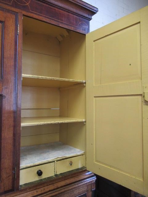 A LARGE GEORGIAN OAK AND MAHOGANY BANDED HOUSEKEEPERS CUPBOARD Image