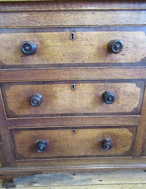 A LARGE GEORGIAN OAK AND MAHOGANY BANDED HOUSEKEEPERS CUPBOARD Image